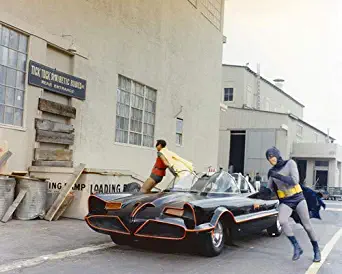 Adam West and Burt Ward in Batman jump out of Batmobile by building 16x20 Poster